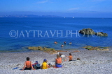 UK, Devon, BRIXHAM, people seated along Breakwater Beach, DEV417JPL