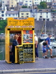 UK, Devon, BRIXHAM, town centre, ticket booth selling fishing trips, DEV394JPL