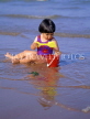 UK, Devon, PAIGNTON, child (toddler) on beach, playing with bucket and spade, DEV361JPL