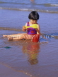 UK, Devon, PAIGNTON, child (toddler) on beach, playing with bucket and spade, DEV362JPL