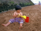 UK, Devon, PAIGNTON, child (toddler) on beach, playing with bucket and spade, DEV368JPL