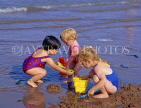 UK, Devon, PAIGNTON, children on beach, playing with bucket and spade, DEV367JPL