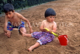 UK, Devon, PAIGNTON, children on beach, playing with bucket and spade, DEV535JPL