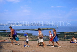 UK, Devon, PAIGNTON, family walking along beach, DEV544JPL
