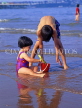 UK, Devon, PAIGNTON, two children on beach, playing with bucket and spade, DEV365JPL