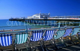UK, Sussex, BRIGHTON, row of deck chairs and Brighton Pier, UK313JPL