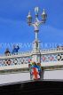UK, Yorkshire, YORK, Lendal Bridge, and bridge lampost, tourist waving, UK3176JPL