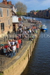 UK, Yorkshire, YORK, people enjoying sunny evening by riverside and Kings Arms Pub, UK3086JPL