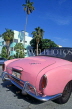 USA, Florida, MIAMI, South Beach, pink sports car and Art Deco  building, MIA683JPL