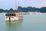 VIETNAM, Halong Bay, moored cruise boats and limestone formations, VT1850JPL