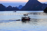 VIETNAM, Halong Bay, traditional fishing boat, out at dawn, VT1807JPL