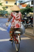 VIETNAM, Hanoi, cyclist wearing conical hat, VT667JPL