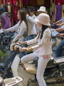VIETNAM, Hanoi, women on motorbikes in traffic, VT526JPL