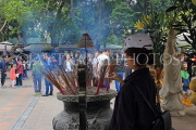 Vietnam, HANOI, Dien Huu Temple site, worshipper by incense burner censer, VT1686JPL