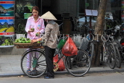 Vietnam, HANOI, Old Quarter, Street Vendor, with customer, selling fruit, VT1499JPL