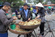 Vietnam, HANOI, outdoor market, street vendor selling yams and nuts, VT1097JPL