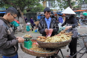 Vietnam, HANOI, outdoor market, street vendor selling yams and nuts, VT1098JPL