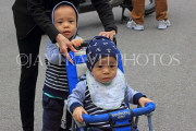 Vietnam, HANOI, two young children on stroller, VT1277JPL