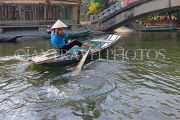 Vietnam, Ninh Binh, TAM COC, Ngo Dong River, woman taking photos of tourists to sell, VT2153JPL
