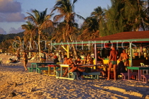 ANTIGUA, West Coast, Jolly Beach, tourists at beach bar, sunset time, ANT797JPL