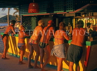 ANTIGUA, West Coast, holidaymakers at beach bar, sunset time, ANT724JPL
