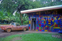AUSTRALIA, Northern Territory, Darwin, TIWI ISLANDS (Bathurst), Aboriginal art on car and building, AUS526JPL