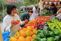 BAHRAIN, Budaiya, Farmers' Market, stalls, peppers, and shopper, BHR2024JPL