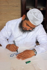 BAHRAIN, Manama, Grand Mosque (Al-Fateh), caligraphy artist on mosque open day, BHR924JPL