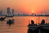BAHRAIN, Muharraq, coastal fishing village area, view towards Shaikh Isa Causeway Bridge, sunset, BHR2516JPL
