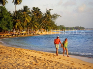 BARBADOS, West Coast, couple walking along beach, BAR442JPL