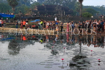 CAMBODIA, Siem Reap, Angkor Wat, tourists gathered to watch the sunrise, CAM387JPL