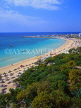 CYPRUS, Aiya Napa, beach with sunshades, and harbour in background, CYP167JPL