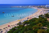 CYPRUS, Aiya Napa, beach with sunshades, and harbour in background, CYP493JPL