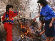 Greek Islands, CRETE, Kritsa village (eastern Crete), traditional roasting of sheep head and trotters, GIS1117JPL