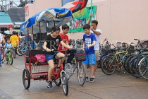 HONG KONG, Cheung Chau island, girl riding hire tricycle, HK1580JPL