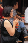 HONG KONG, Kowloon, Wong Tai Sin Temple, worshipper shaking Fortune Sticks, HK1147JPL
