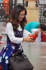 HONG KONG, Kowloon, Wong Tai Sin Temple, worshipper shaking Fortune Sticks, HK1158JPL