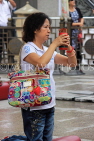 HONG KONG, Kowloon, Wong Tai Sin Temple, worshipper shaking Fortune Sticks, HK1159JPL
