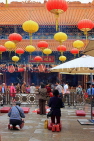 HONG KONG, Kowloon, Wong Tai Sin Temple, worshippers in front of main altar, HK1110JPL