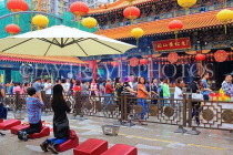 HONG KONG, Kowloon, Wong Tai Sin Temple, worshippers in front of main altar, HK1114JPL