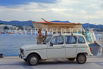 IBIZA, San Antonio Bay, man fixing his small boat onto car, SPN1416JPL