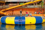 JAMAICA, Montego Bay, Margaritaville, giant tube bouncing play area, and tourist family, JM397JPL