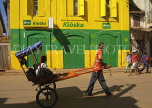 MADAGASCAR, Ambalavao, pousse pousse driver with passenger, MDG208JPL
