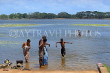 SRI LANKA, Anuradhapura, Basawakkulama tank (Abhaya Wewa), people bathing, SLK5563JPL