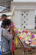 SRI LANKA, Anuradhapura, Ruwanweliseya Dagaba, worshipper at shrine, SLK5730JPL