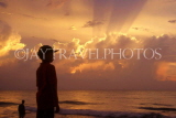 SRI LANKA, Negombo, boy silhouetted against sunset, SLK1682JPL
