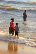 SRI LANKA, Negombo, evening by the seaside, people enjoying paddling, SLK5945JPL