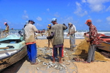 SRI LANKA, Negombo, fishing village, fishermen sorting the catch from their nets, SLK5984JPL