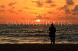 SRI LANKA, Negombo, sunset, sea, and woman on beach, SLK6039JPL