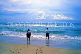 SRI LANKA, south coast, Beruwela, two people paddling on beach, SLK1996JPL